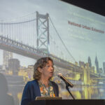Laura Lawson speaking at podium